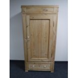 An antique pine hall wardrobe