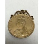 A mounted silver-gilt four shilling coin pendant