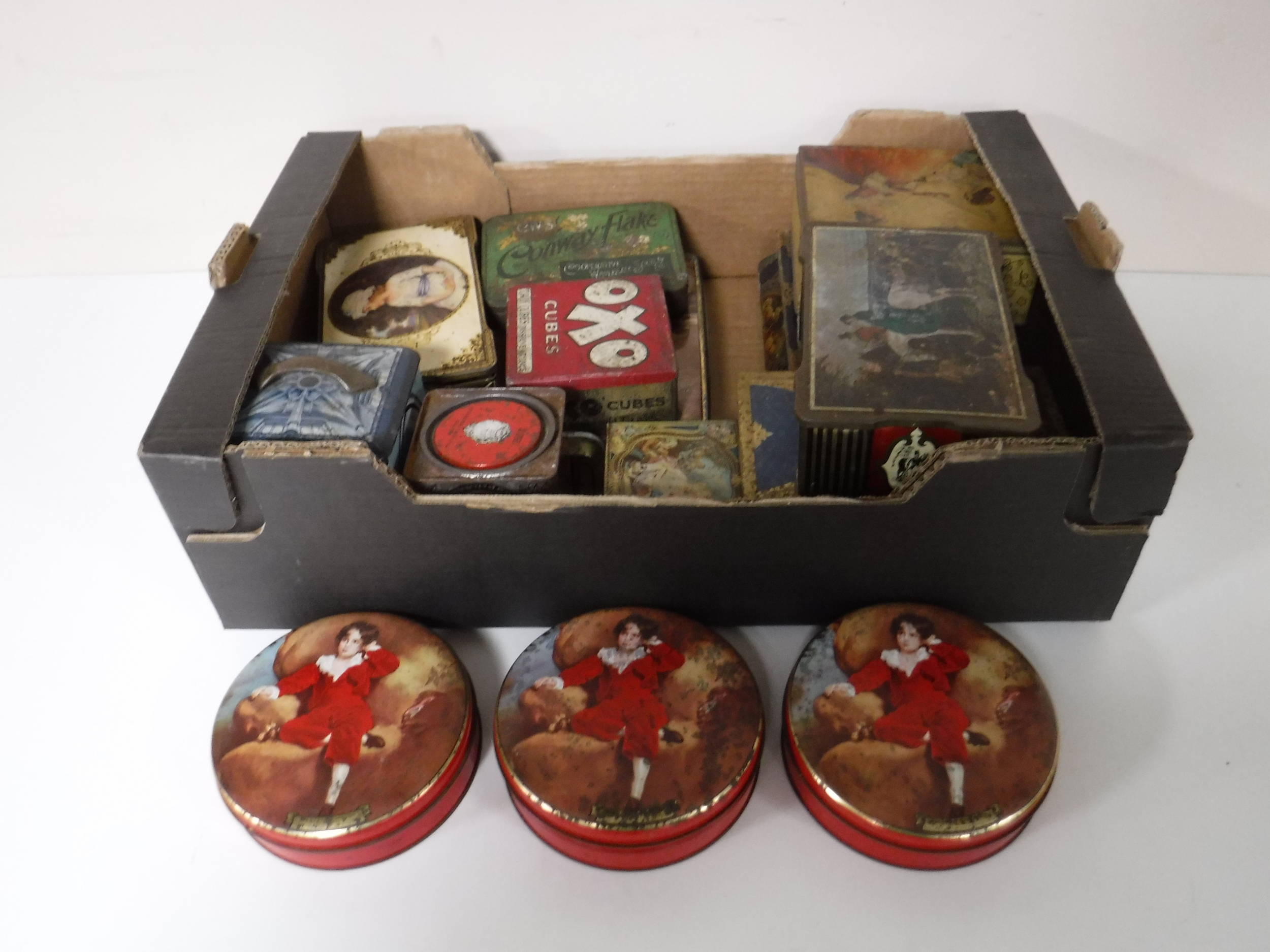 A box containing vintage tins