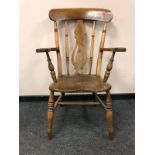 A Victorian elm armchair