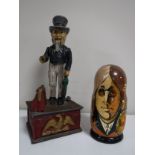 A cast iron Uncle Sam savings bank together with a set of Beatles dolls