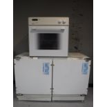 An intergrated fridge freezer and electric oven