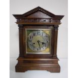 An early 20th century mahogany bracket clock with brass and silvered dial.