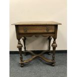 A William and Mary style oak side table fitted with a drawer, width 68 cm.
