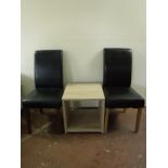 Two odd high backed leather chairs together with a two tier side table