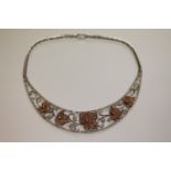 An impressive 18ct white and rose gold diamond set necklace,