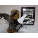 An eagle figure on wooden base, angel poised lamp,