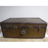 An early twentieth century metal bound travelling trunk