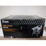 A boxed Titan 1500 W table saw and a cased Disto Leica meter