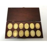 A boxed set of ten commemorative silver-gilt coins,