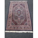 A Tabriz design rug, 194cm by 119cm. CONDITION REPORT: In good condition. Hand woven.