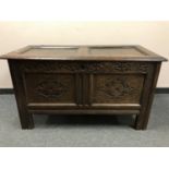 A George III panelled oak coffer,