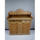 An antique pine buffet backed sideboard