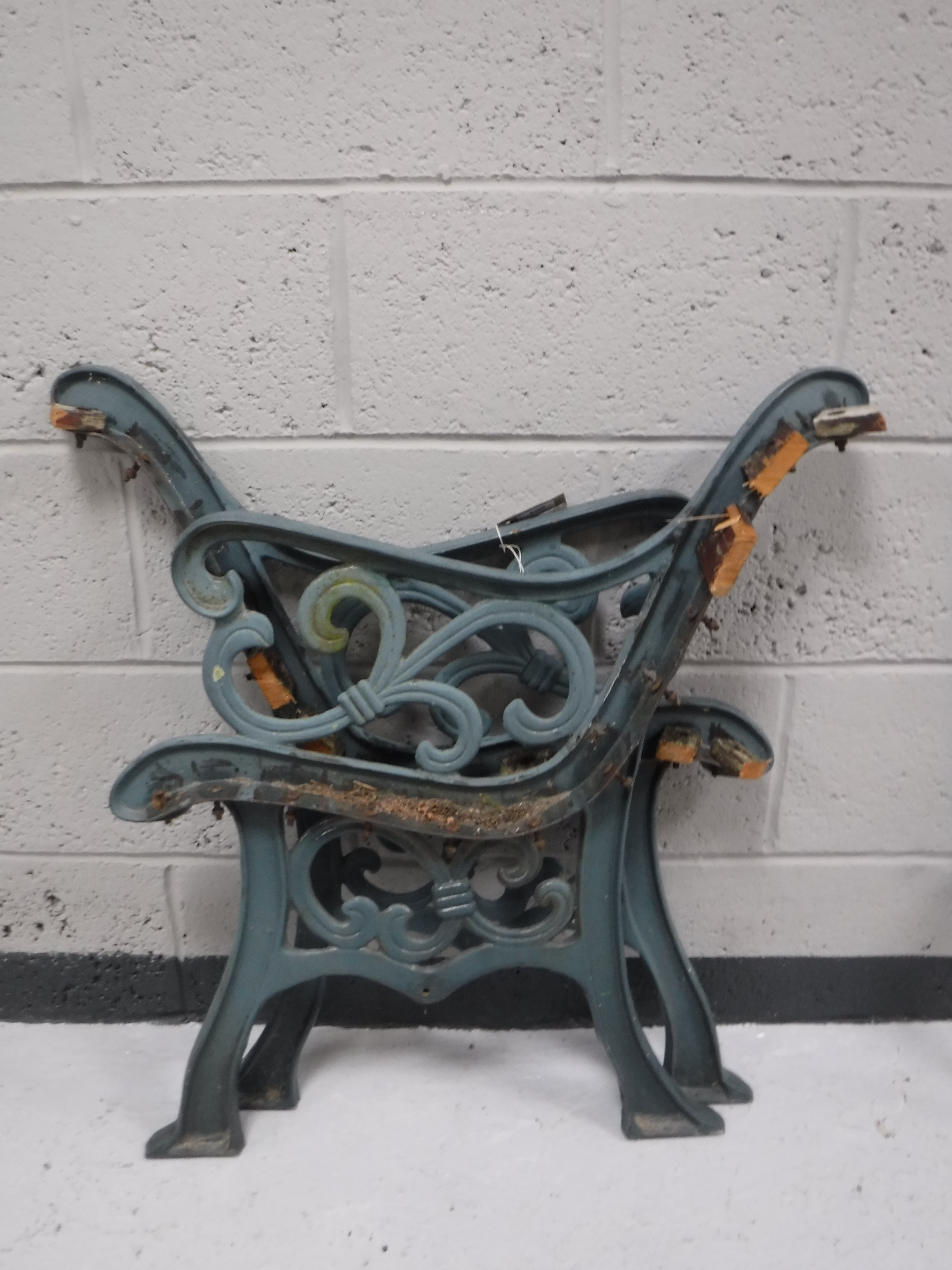 A pair of cast iron bench ends