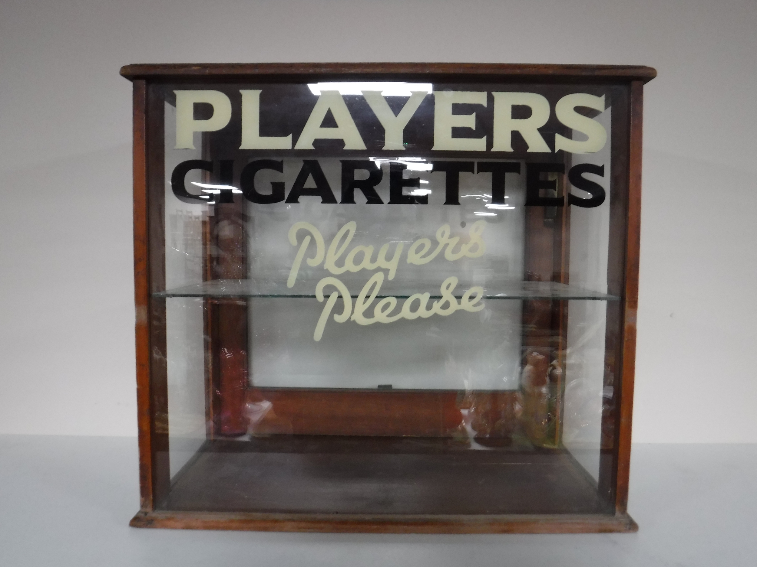 A mahogany counter top display cabinet - Player's cigarettes