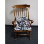 A stained beech rocking chair