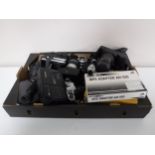 A box of assorted cameras and accessories