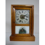 A pine cased American mantel clock.