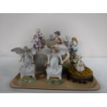 A quantity of continental figures including an Art Nouveau figure,