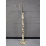 A marble topped twist column standard lamp