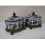 A pair of ormolu mounted blue and white oval lidded caskets