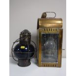 A brass ships lantern together with another ships lamp