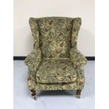 A Parker Knoll wing backed armchair