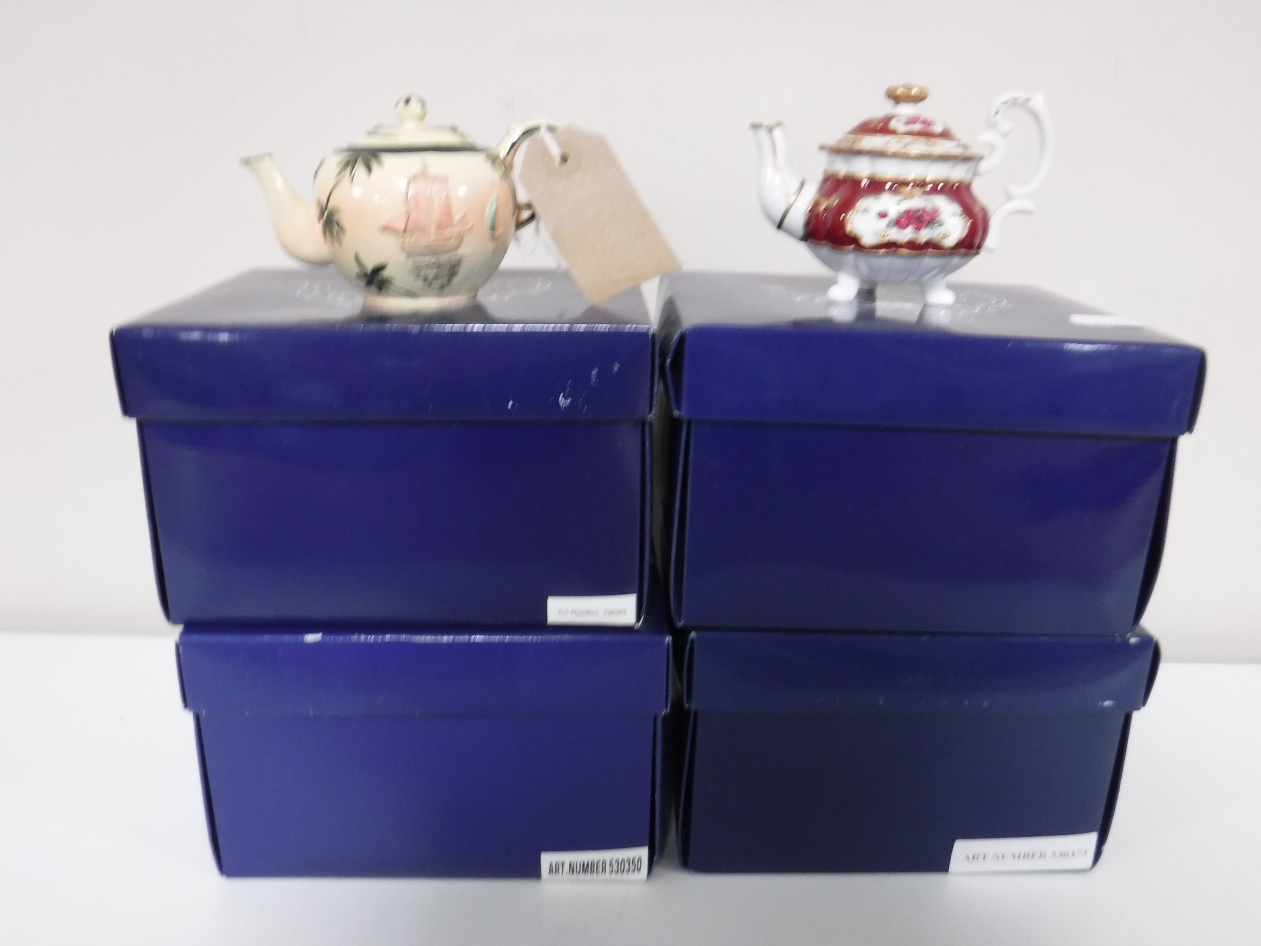 A collection of twenty five Mayfair miniature teapots (boxed)