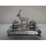 An early twentieth century plated desk stand surmounted with a stag