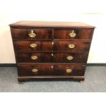 A George III mahogany five drawer chest on bracket feet,