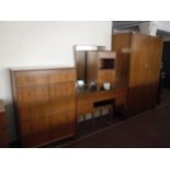 A six piece mid twentieth century walnut bedroom suite comprising of double door wardrobe,