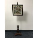 A Victorian rosewood pole screen