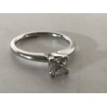 A white gold square cut diamond solitaire ring, size J, approximately 0.5ct.