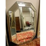 A contemporary panelled cushion mirror,