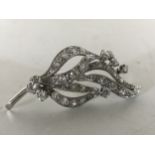 An 18ct white gold diamond spray brooch, 9.6g, approximately 2ct.