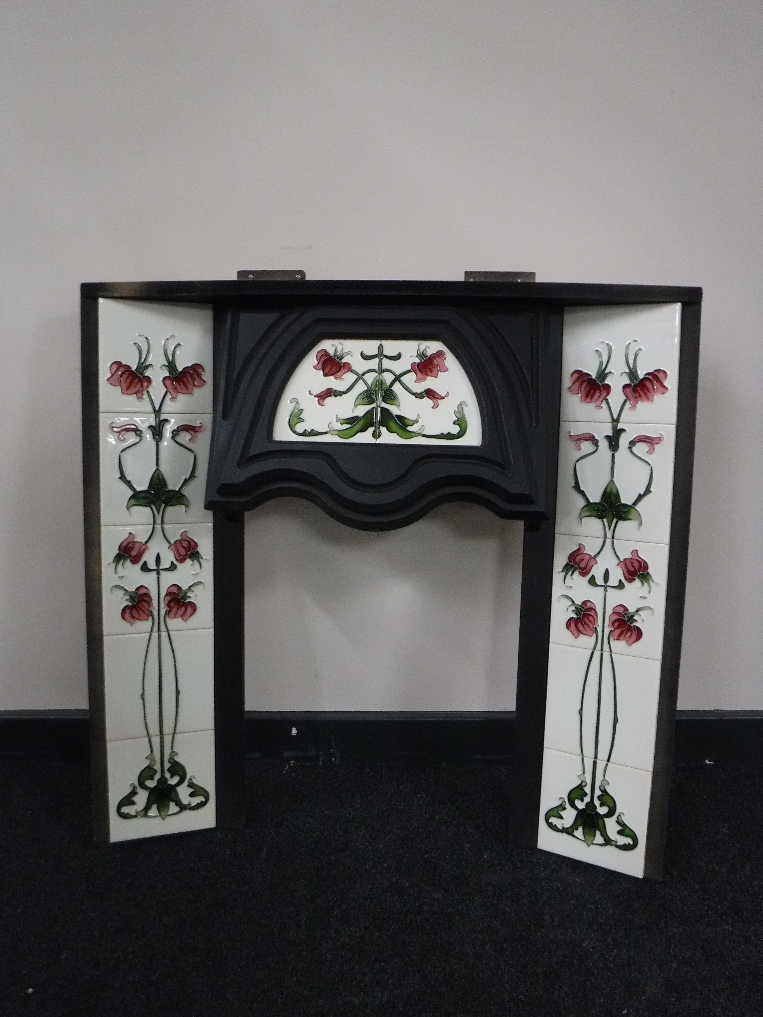 A Victorian style tiled fire insert