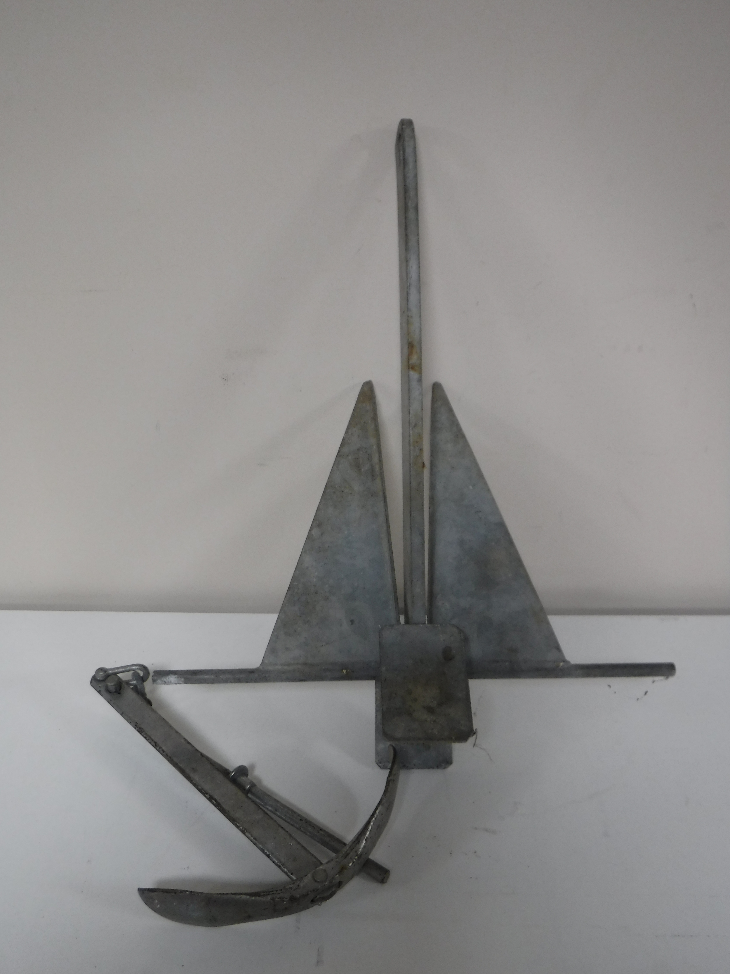 A galvanized Danforth style anchor and one other.