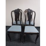 A set of four oak Queen Anne style chairs