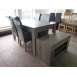 A contemporary dining table together with a set of four leather dining chairs and matching