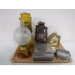 A tray of oil lamp, two paraffin lamps, metal table casket, money box,