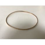 A 14ct gold bangle CONDITION REPORT: 4.