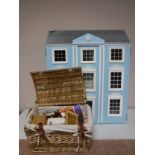 A Victorian style doll's house and a basket of assorted doll's house furniture