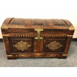 An Eastern style brass inlaid domed chest
