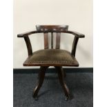 An early twentieth century oak captain's desk chair