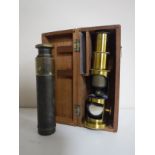 A cased miniature brass microscope together with a pocket brass telescope