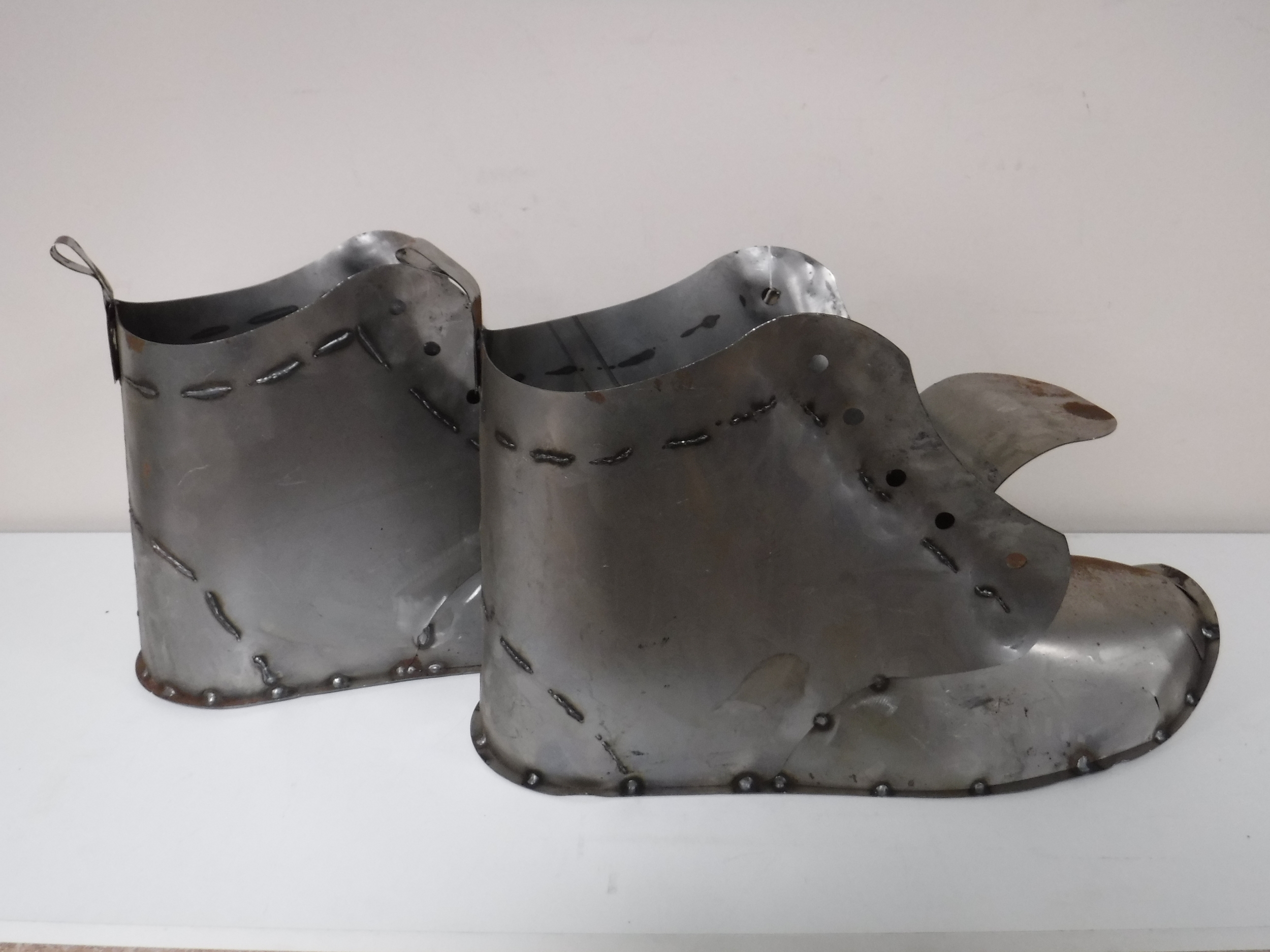 A pair metal garden boot planters