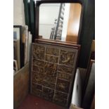 A mid twentieth century teak framed mirror together with a mahogany framed wall mirror and tiled