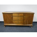 A continental oak sideboard fitted three drawers