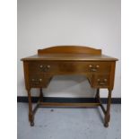 An Edwardian satin walnut dressing table