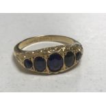 An 18ct gold five stone sapphire ring, size K, 2.9g.